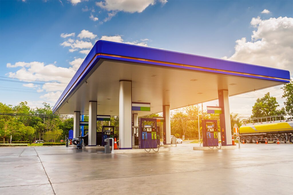 Gas Station With Clouds Sky and Sun Light